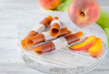 کالری لواشک هلو + جدول ارزش غذایی، خواص، مضرات و نکات طلایی مصرف